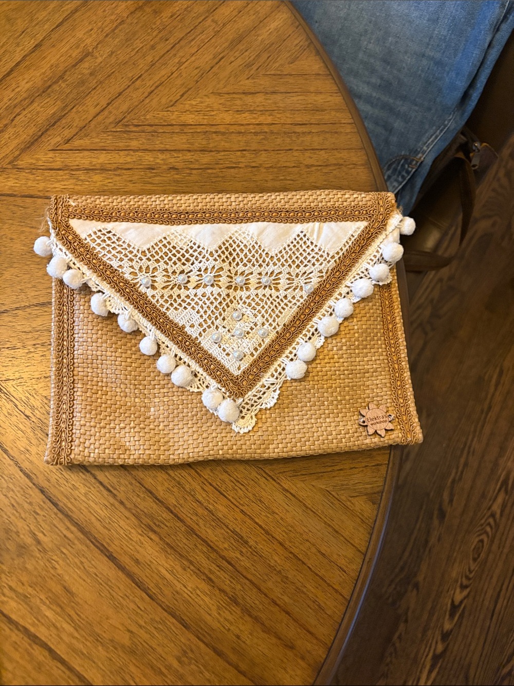 Woven Straw Clutch with White Lace Pom Trim - handmade from Greece.